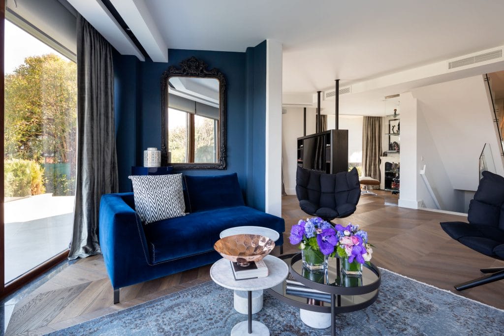 Bold living room paint colors in an interior by Decorilla designer, Meric S.