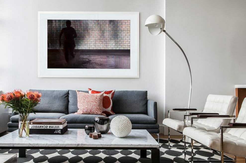 Marble-coffee-table-living-room-contemporary-with-white-modern-chairs-orange-patterned-pillow