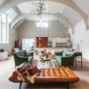 Eclectic interior with dark walls and statement artwork