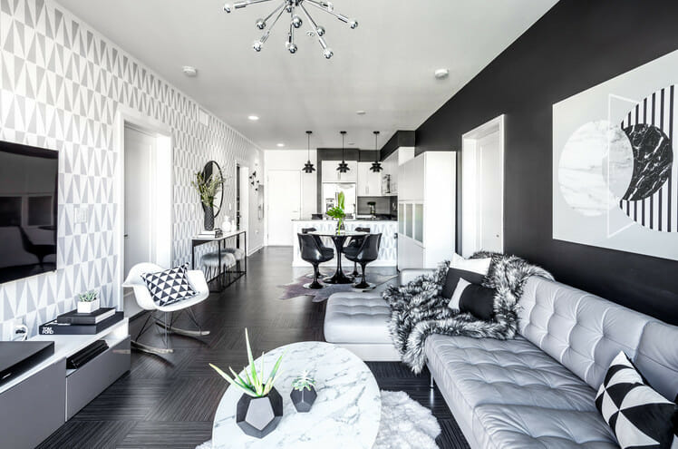 black and white living room decor with greenery