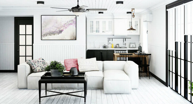 black and white living room decor with pink accents