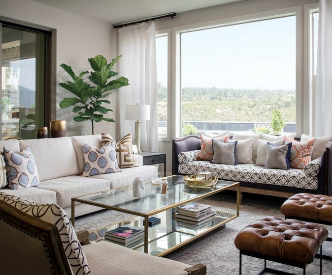 transitional white formal living room with traditional seating and geometric patterned scatter cushions
