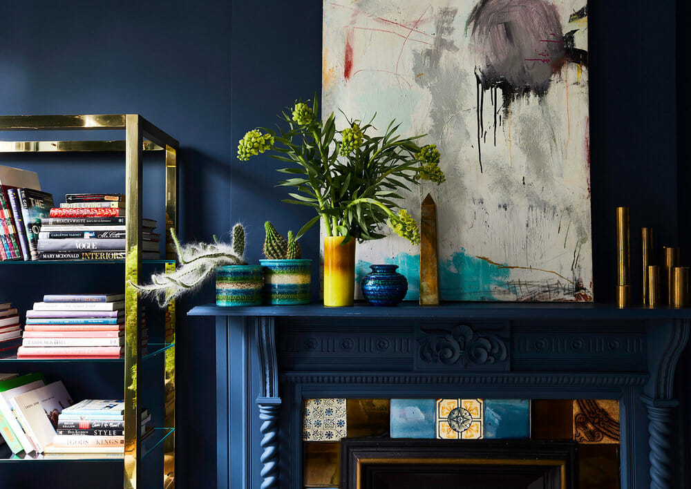 original art in a moody blue lounge