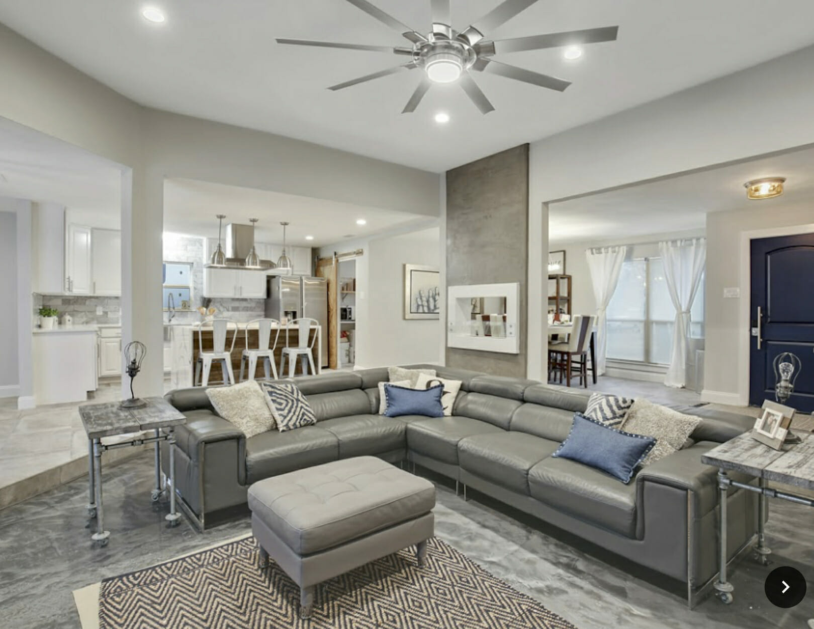 Contemporary open living room design by Decorilla home decorator in Dallas, Holly M.