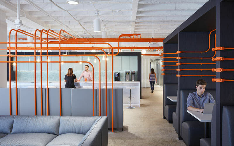 modern-office-design-orange-conduit-pipes-design-feature-wayfinding-path