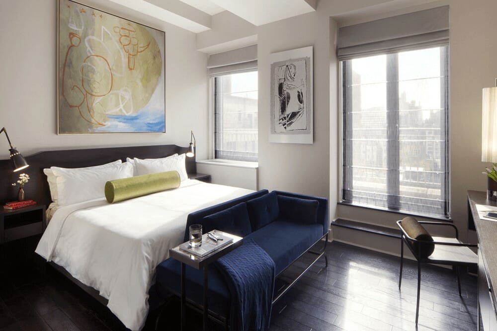 Contemporary bedroom in New York with blue and gold home decor accents