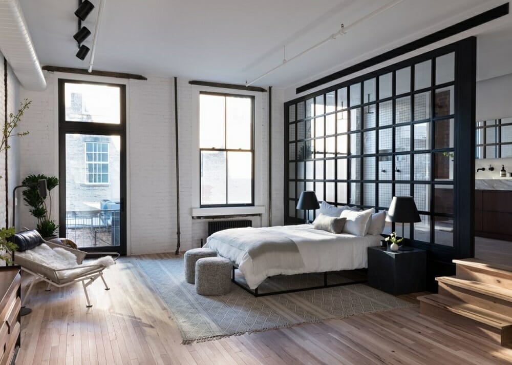 Contemporary industrial bedroom with monochromatic home decor in NYC