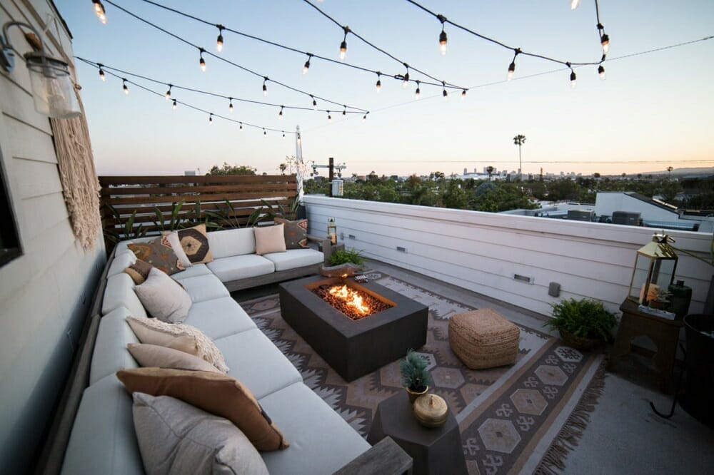 Beautiful rooftop patio design with a firepit