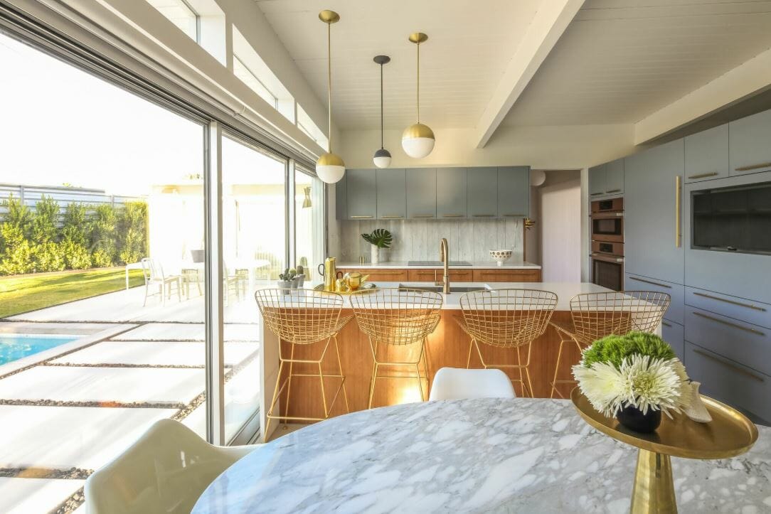 Bright and airy kitchen and dining room with a mid century interior design