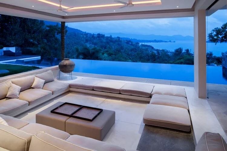Luxury patio with a large seating area next to an infinity pool - a design a patio online result