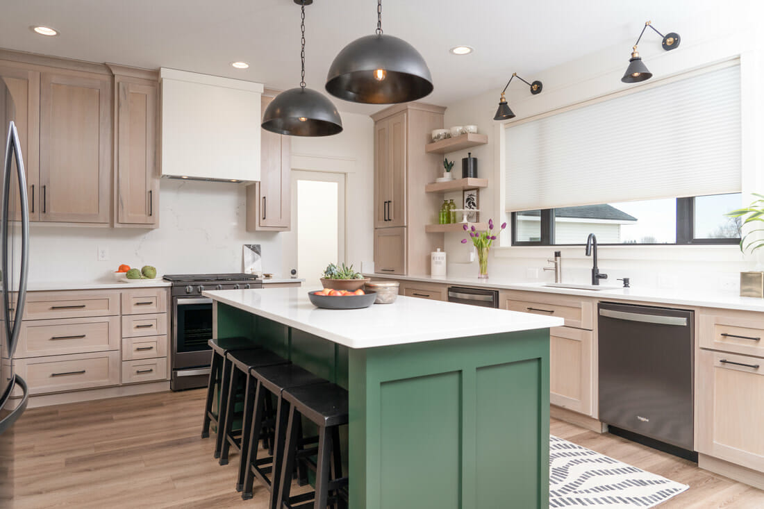 Cute kitchen design with a green kitchen island and black pendants by SBD - interior design gift certificate idea