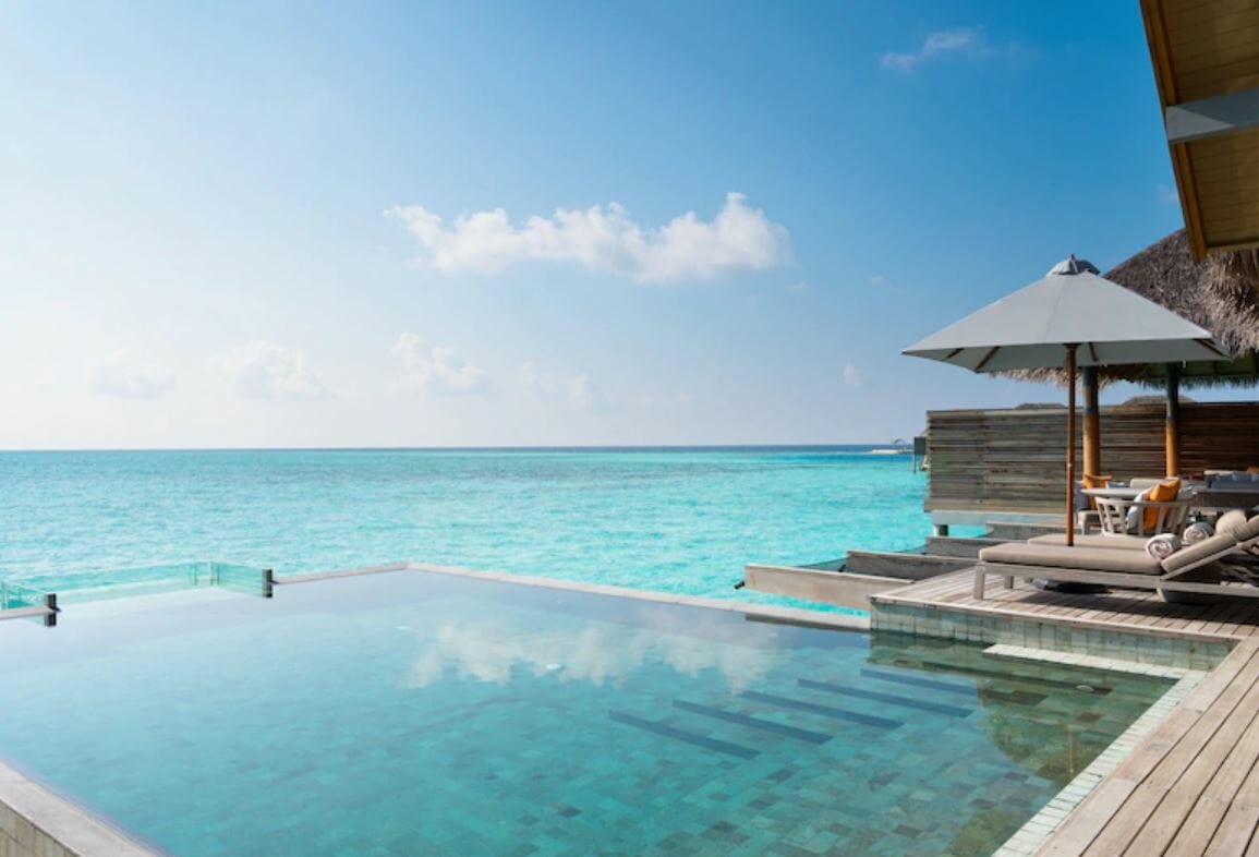 Swimming pool overlooking Maldive's tranquil waters, by Hotels.com - romantic gift card ideas for Valentine's Day