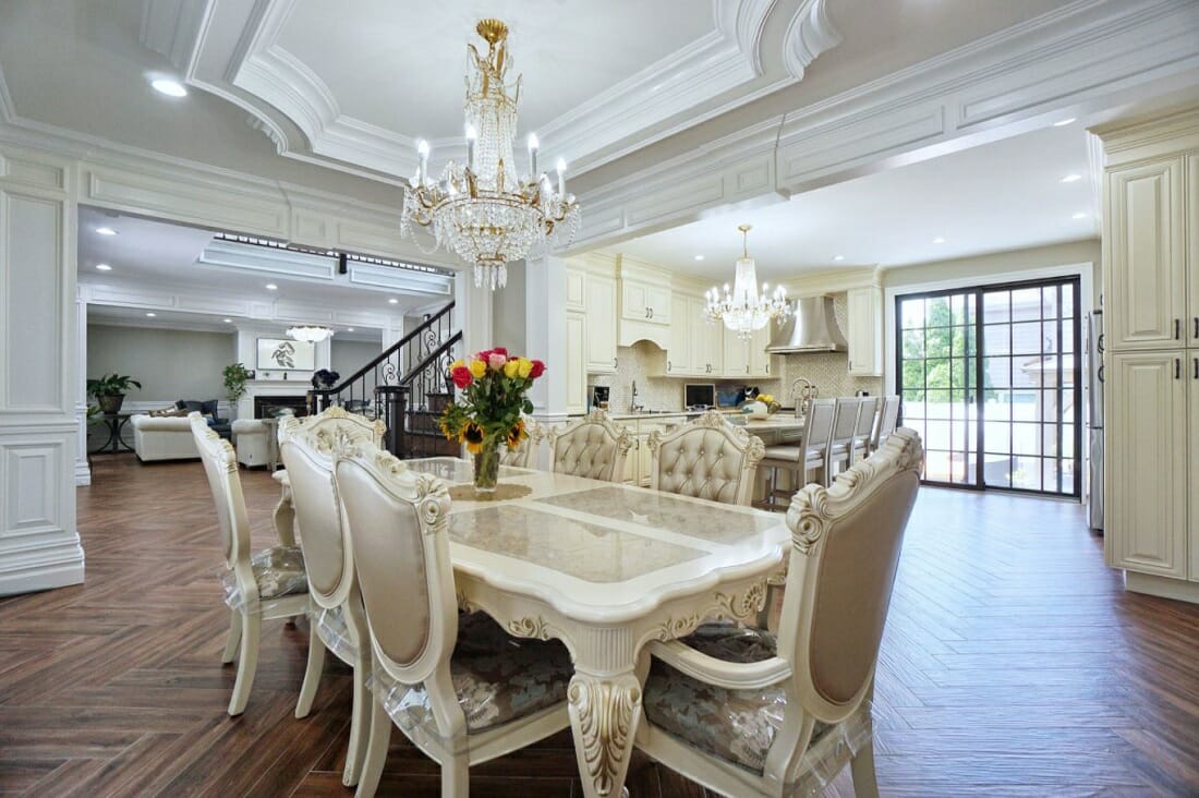 Traditional home style dining room with French Rococo tufted chairs and extendable table