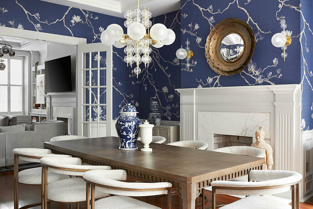 Electic contemporary dining room with a blue wallpaper by W+B - best interior designers in Philadelphia