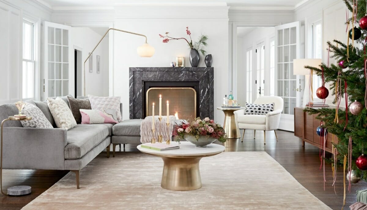 A living room full of interior design presents and luxurious modern furniture and holiday ornaments by West Elm