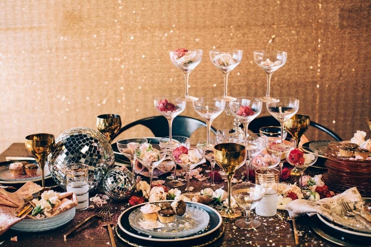 Disco new years centerpiece with champagne glasses