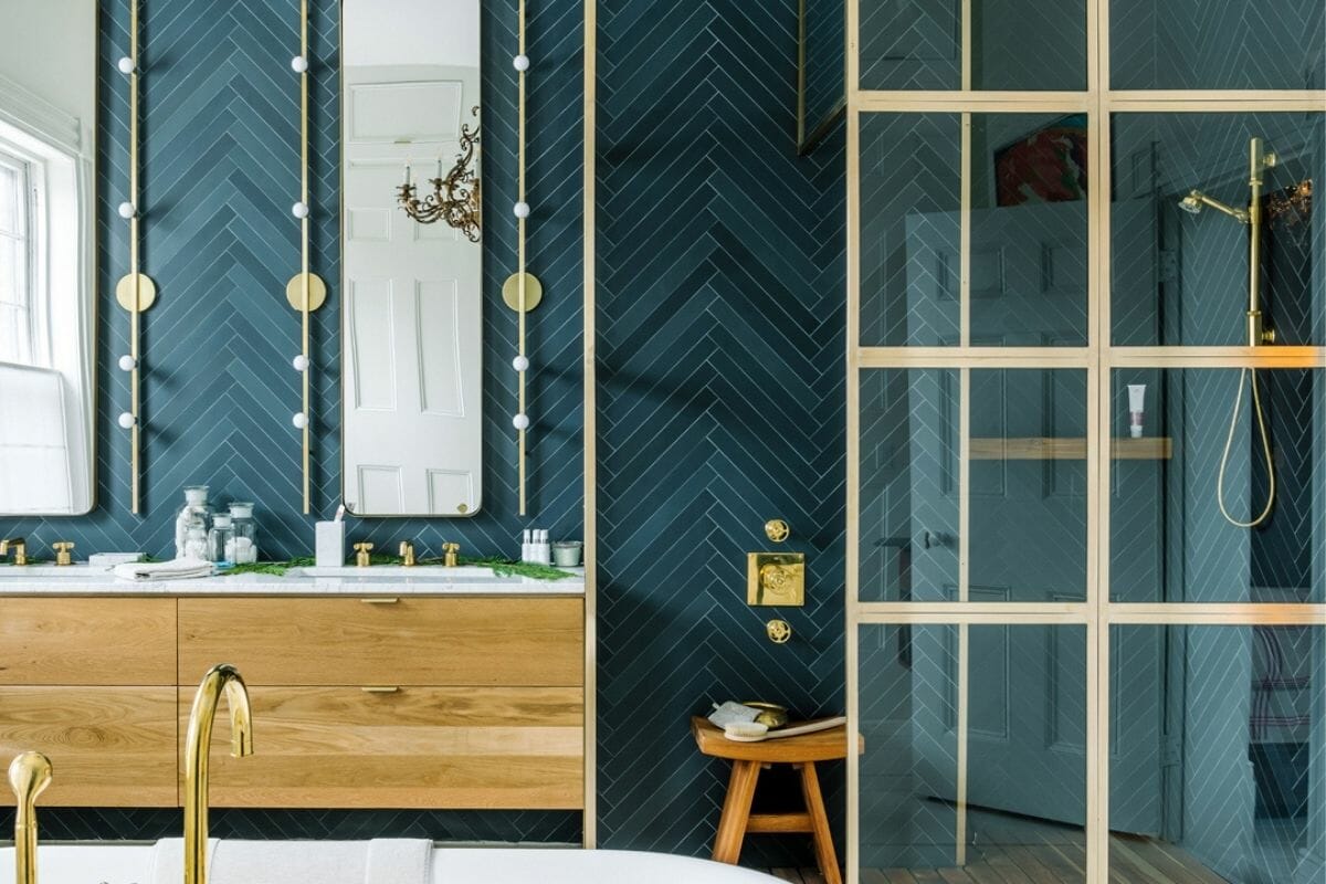 2021 bathroom trends with teal bathroom tiles and gold fixtures