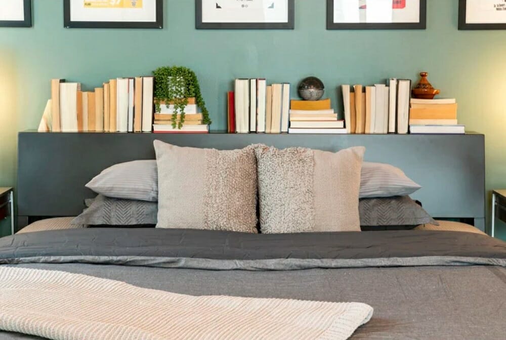 A bed headboard with a shelf for books - how to make a room look bigger