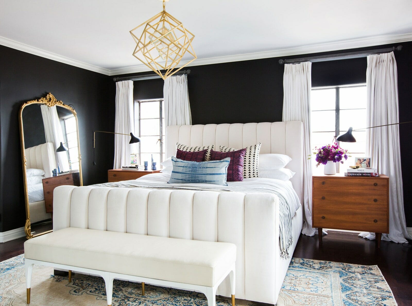 Bold black walls for a modern master bedroom layout