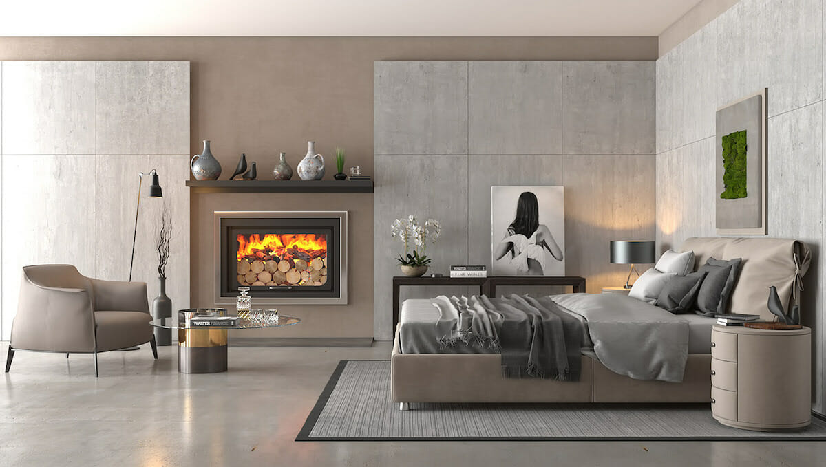 Contemporary master bedroom design with cozy fireplace seating area