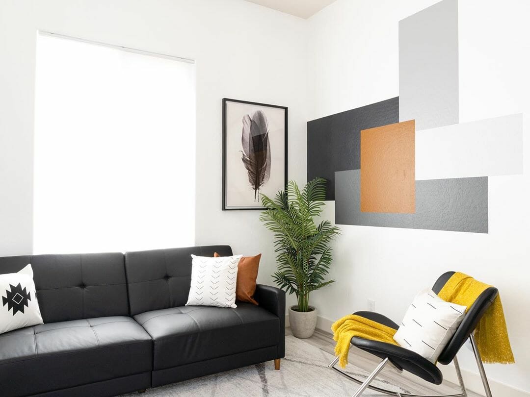 Grey accent wall as artwork in living room