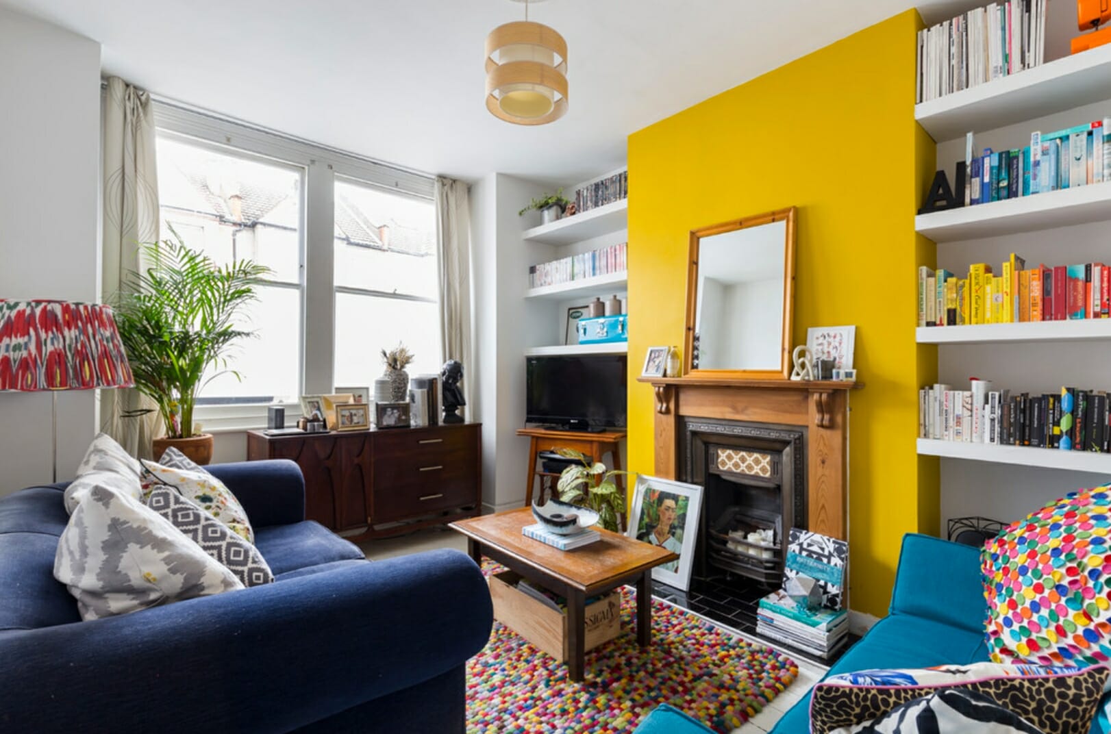 Magnificent yellow accent wall over the fireplace