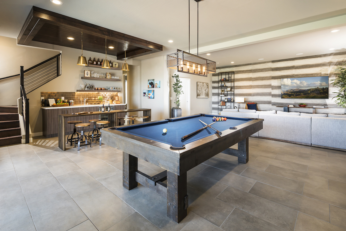Modern in home bar with a pool table and lounge area