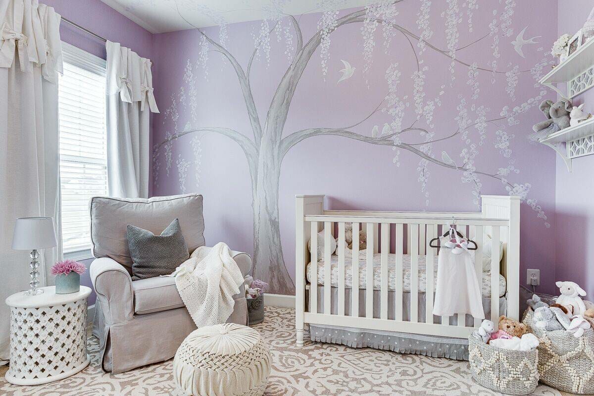 Nursery design in purple accent wall