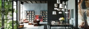 Large open concept interior filled with industrial decor and wall decor - homedit