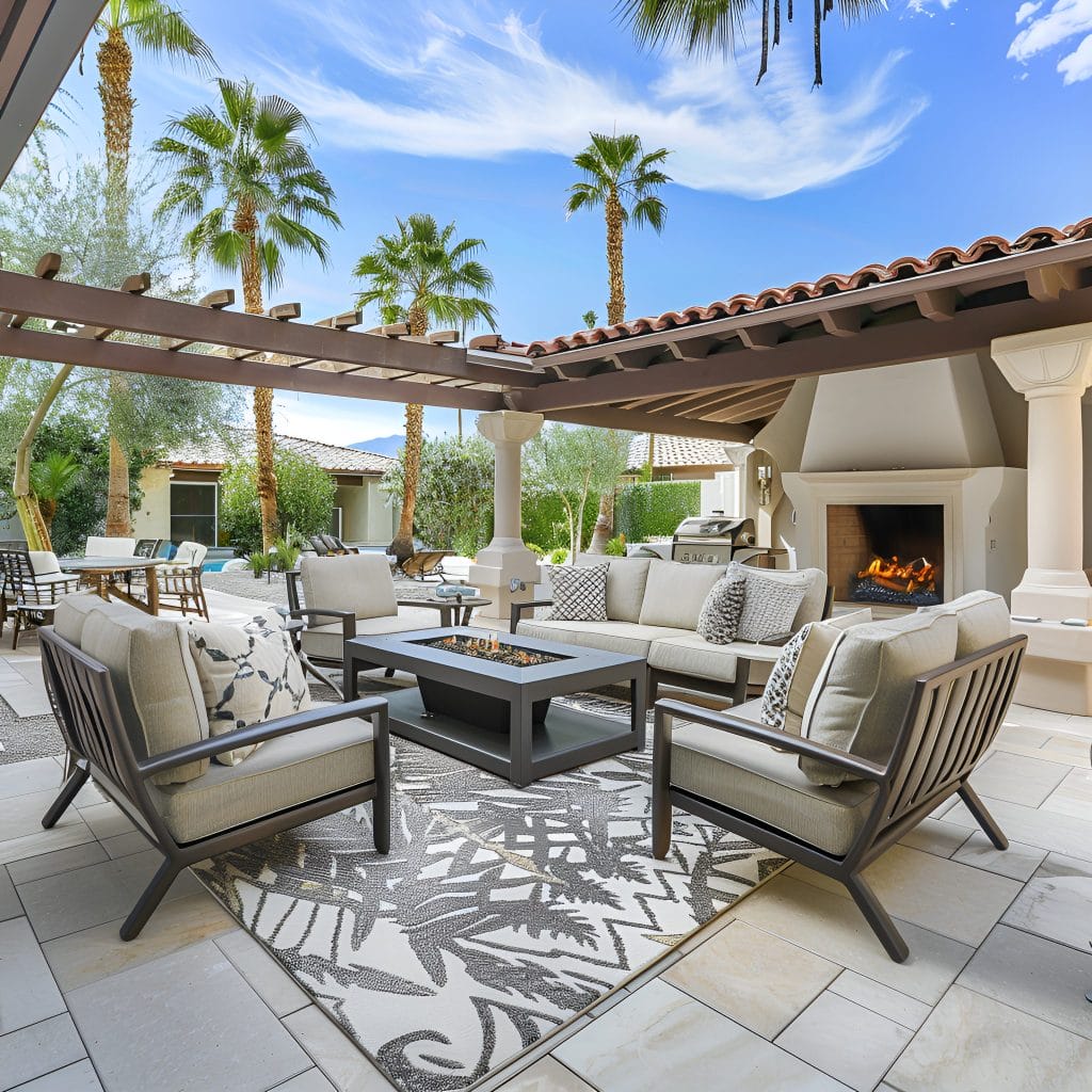 Poolside outdoor living room with a fire pit and pool decoration, by Decorilla