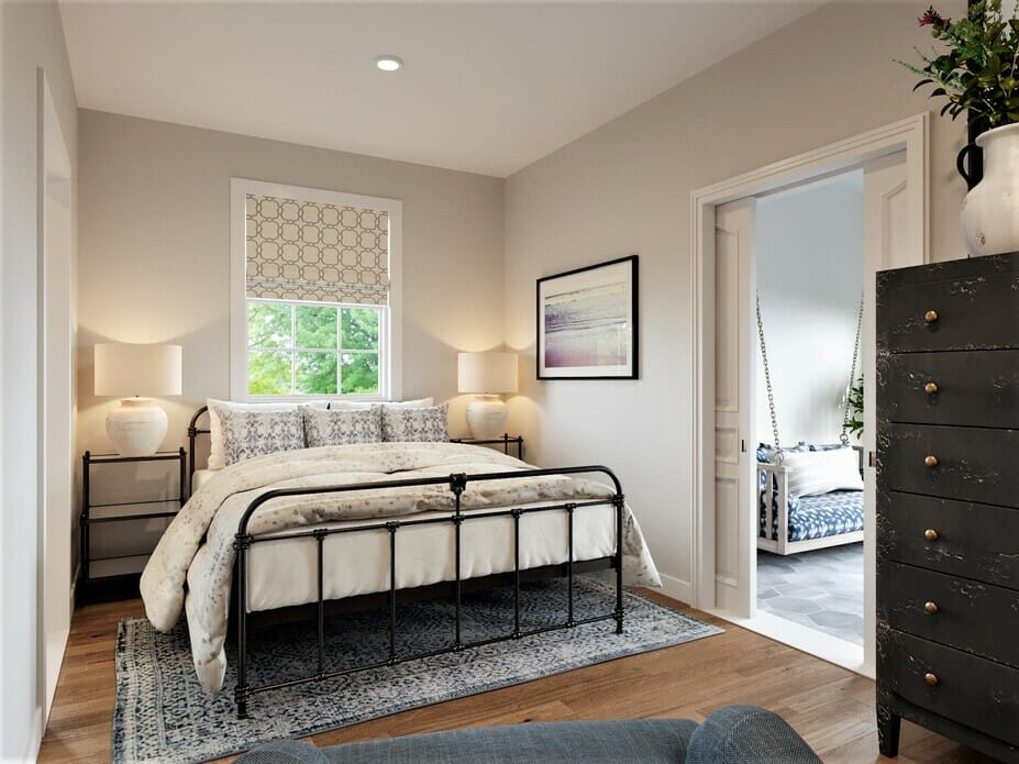 Coastal bedroom with a dresser and steel bedframe