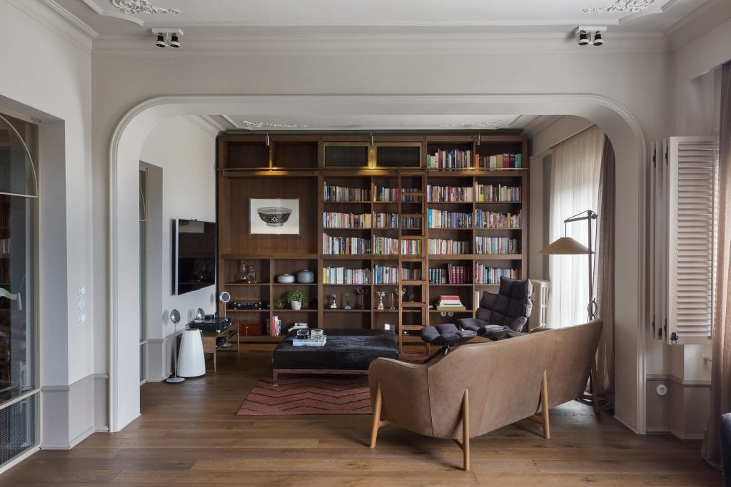 Library and entertainment area in a large living room layout by Decorilla designer, Meric S.