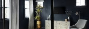 Dramatic black ceiling bedroom
