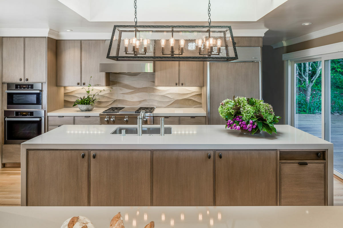 Luxury kitchen with a statement marble backsplash by Decorilla designer tiara m