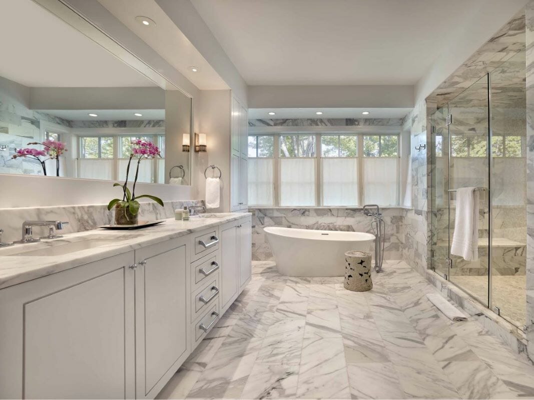 Monochrome floor-to-ceiling marble tile bathroom ideas by Decorilla designer Rachel H