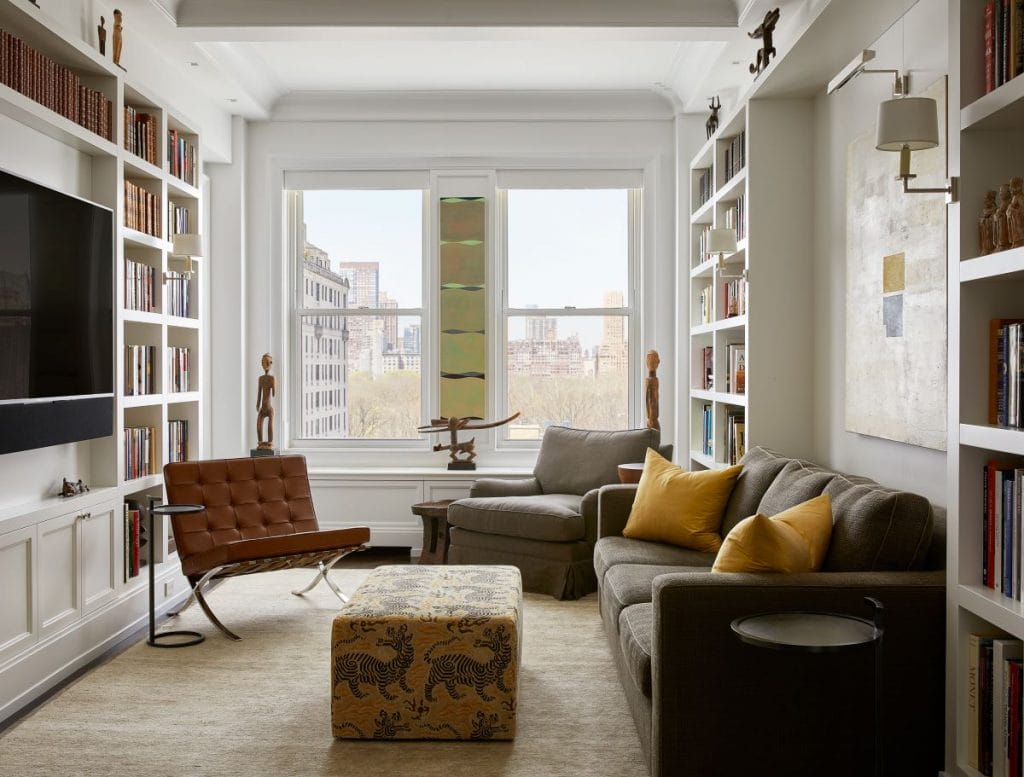 Timeless home library in a sitting room interior by Decorilla designer Leonora M.