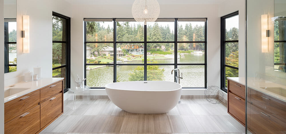 Master bathroom with a freestanding tub by Decorilla designer Autumn M