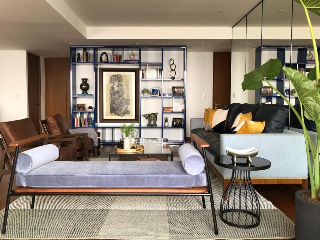 Mid-century modern furniture in a contemporary living room by Decorilla designer, Sofia V.