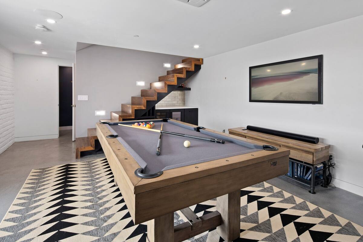 Basement with a industrial meets mid-century modern style