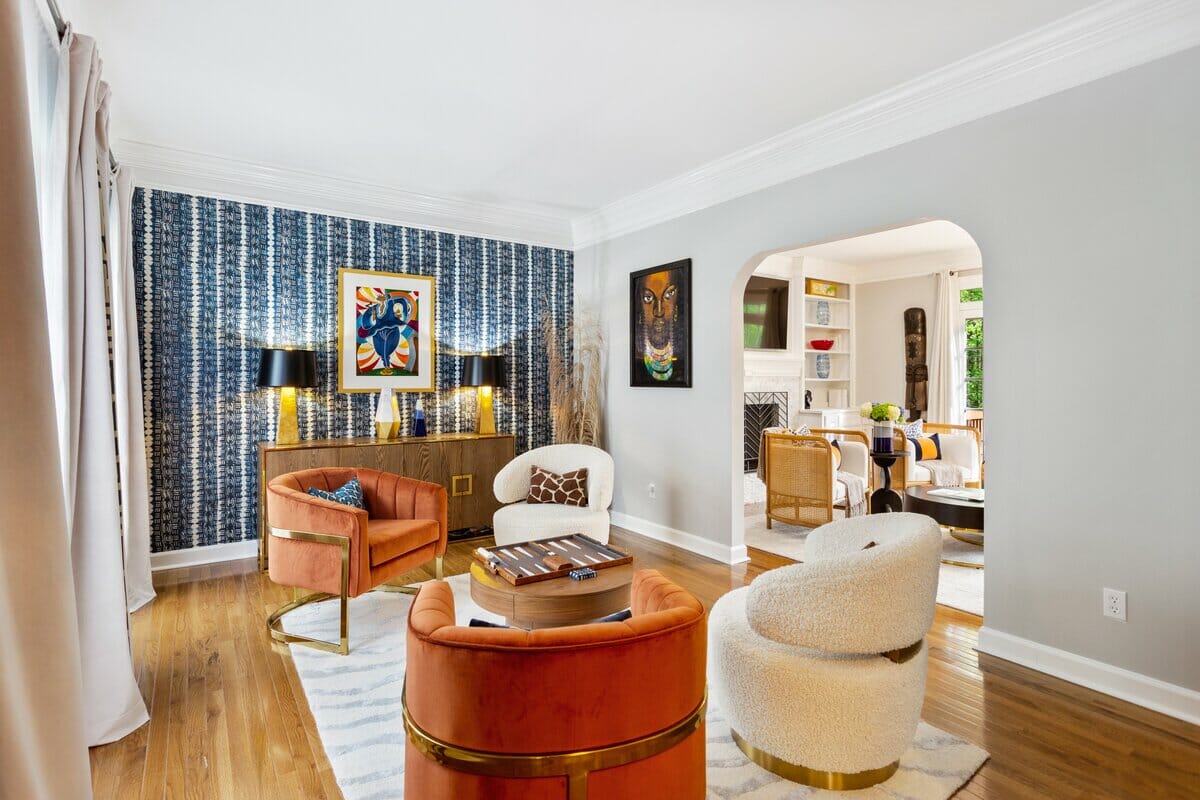 Boucle accent chairs in eclectic and simple living room design by Decorilla designer Sierra G