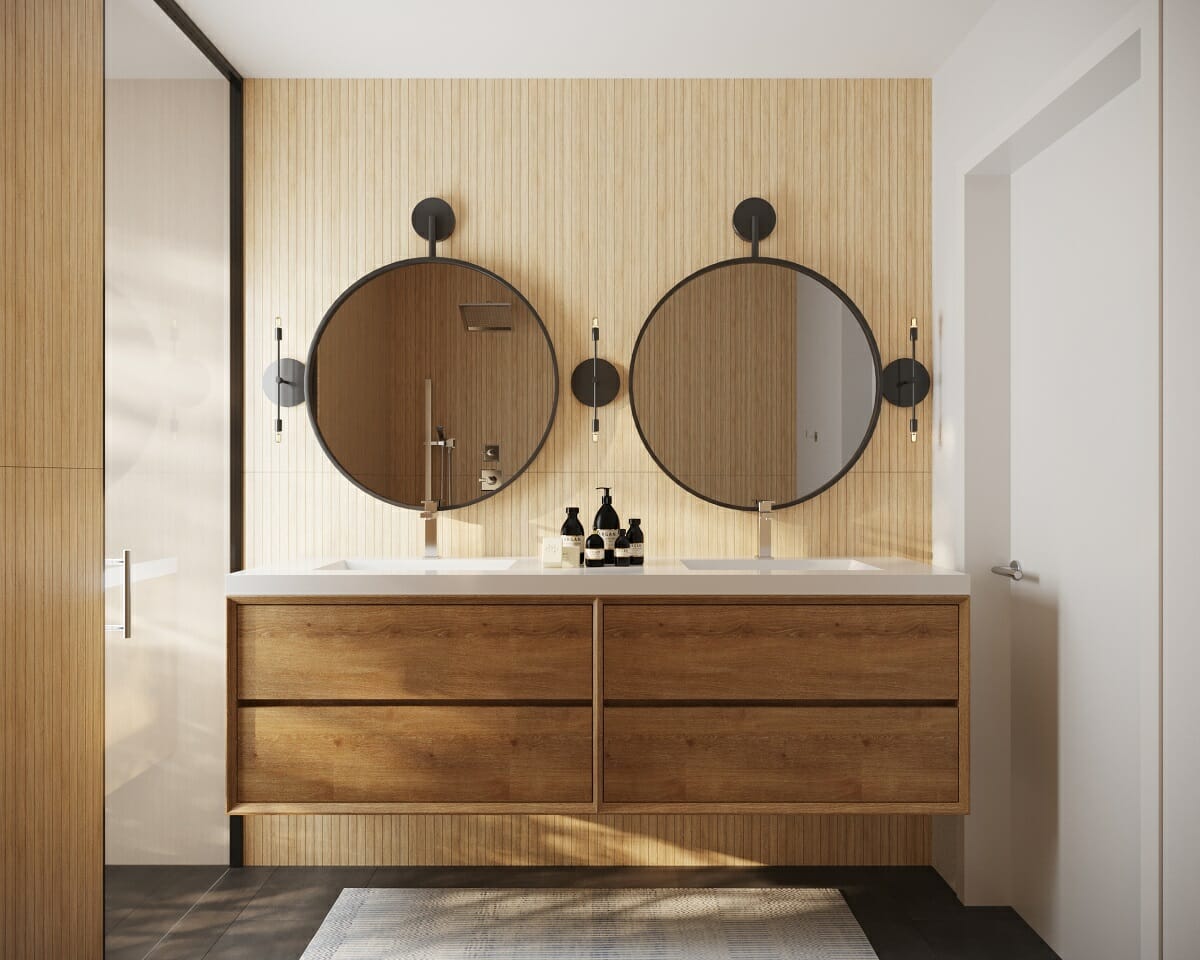 Bathroom ideas 2023 show minimal wall sconces like this design by Courtney B