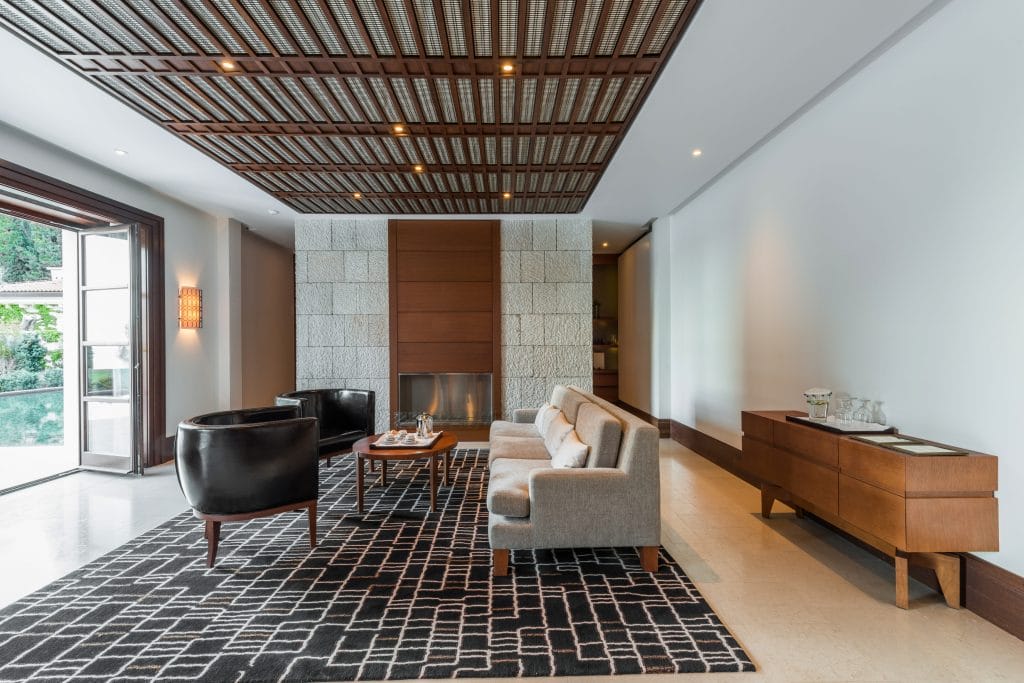 Minimalist living room with mid-century vibes by Decorilla designer, Amelia R.