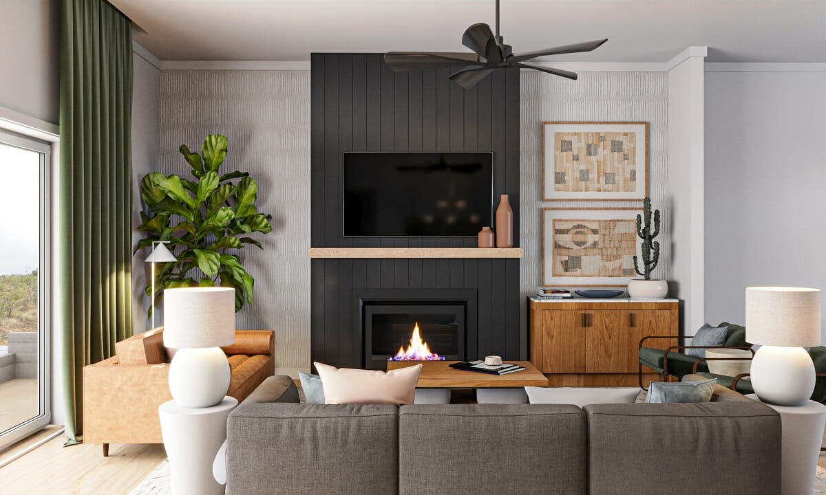 Black fireplace accent wall in a living room by Ryley B