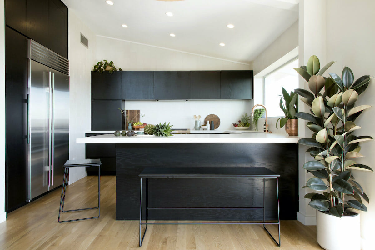 Black kitchen cabinets with light floors by Decorilla designer Jamie M