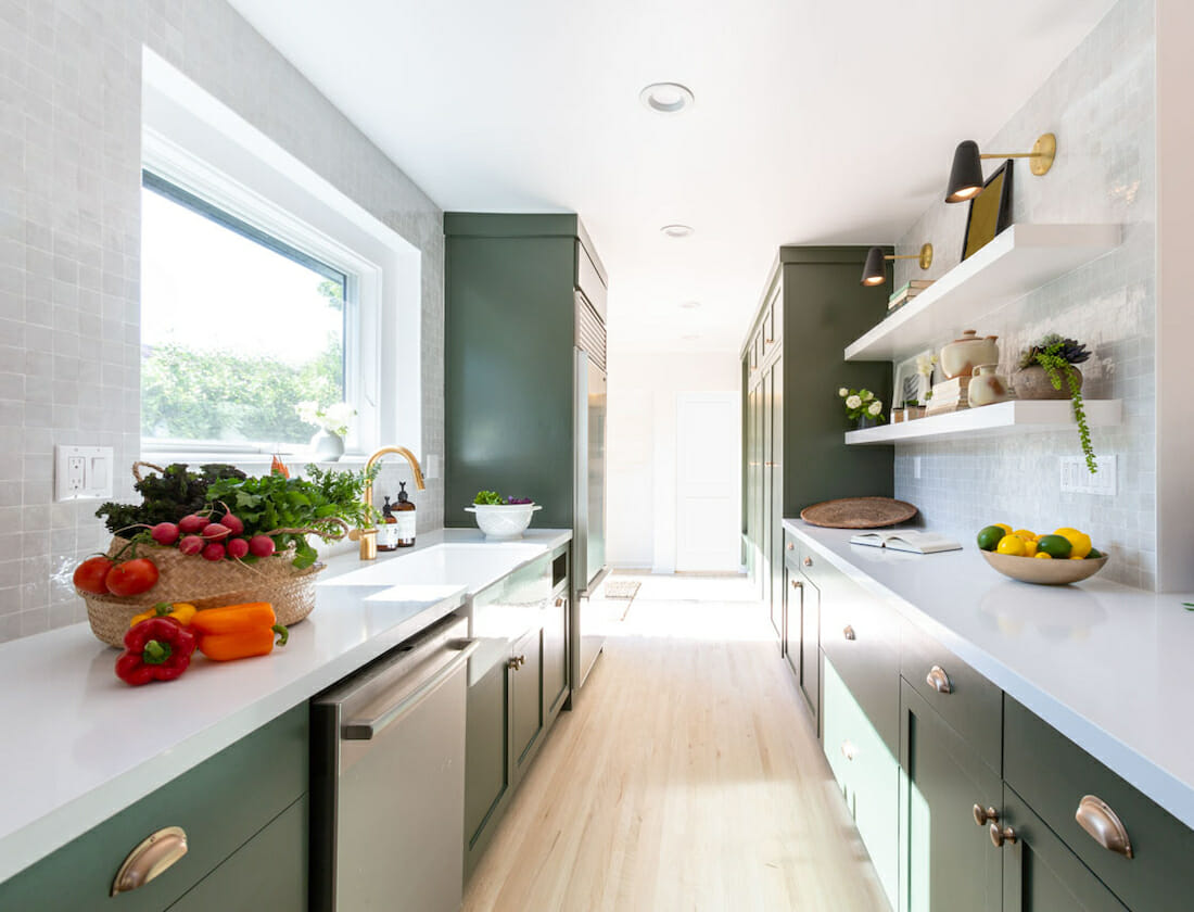 The dark green kitchen design was created by Decorilla designer Britney W.