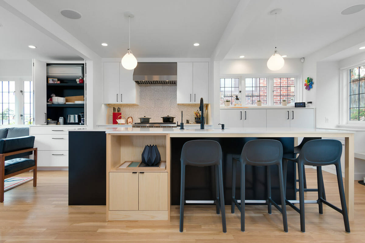 Island with dark kitchen cabinets by Decorilla designer, Betsy M.