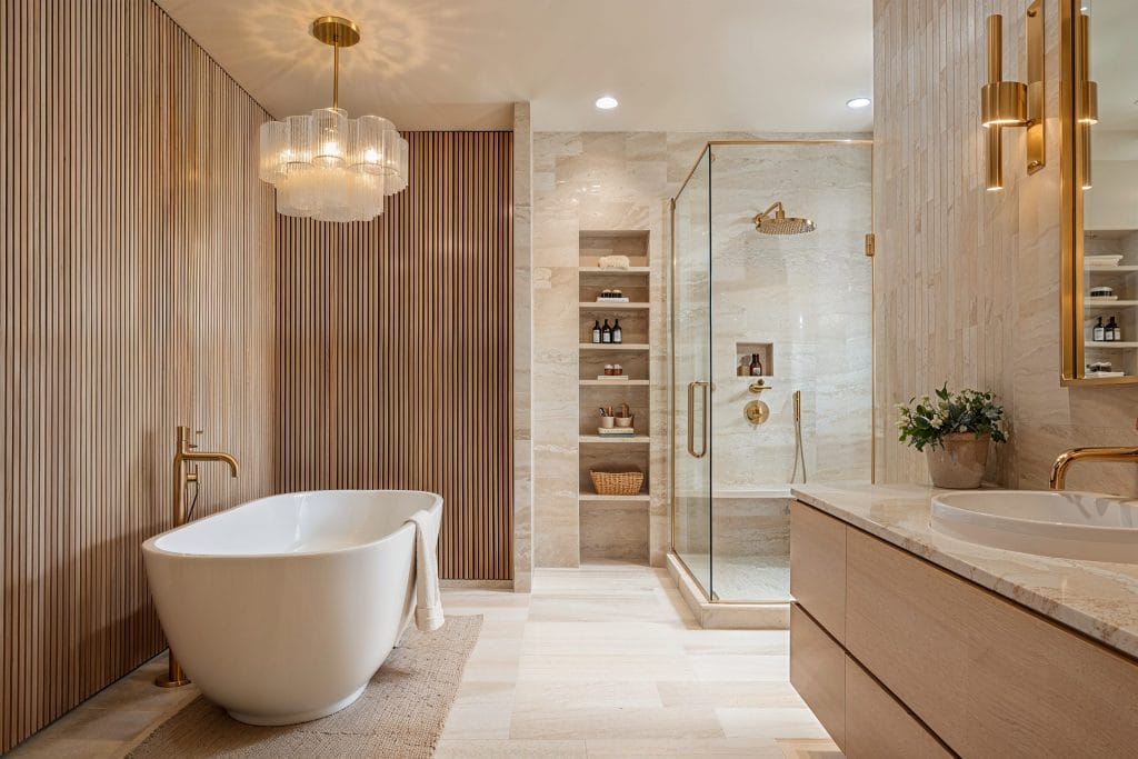 Reeded wood panel accent wall in a contemporary bathroom by Decorilla