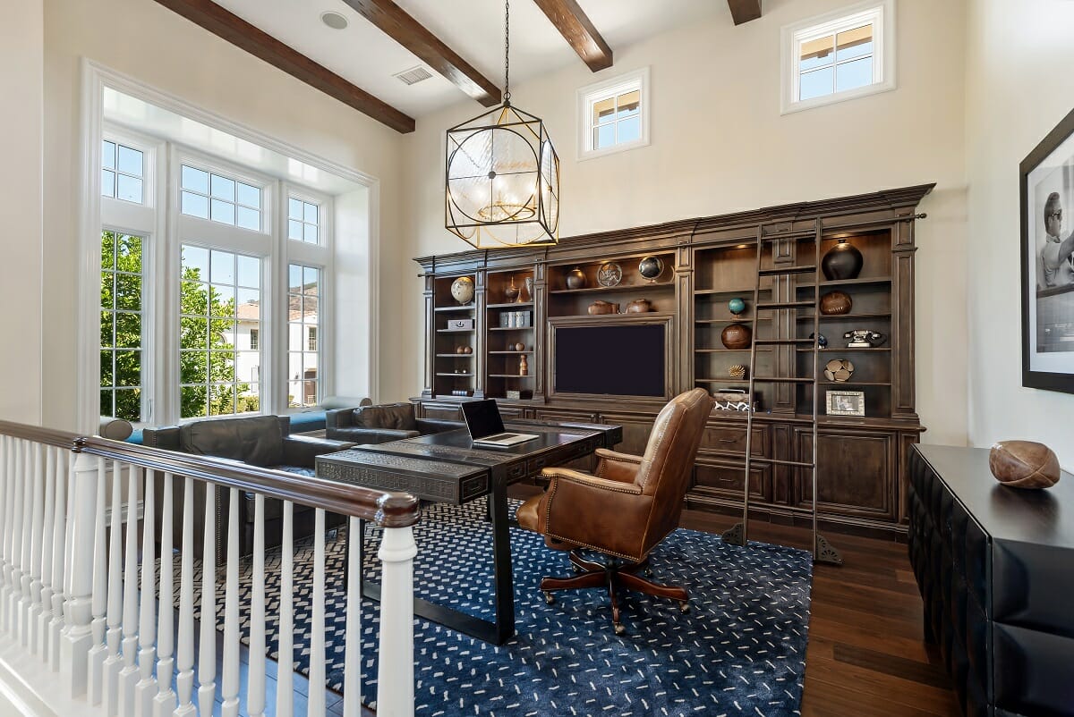 Southern office interior design with leather chairs and built-in bookshelves by Lori D