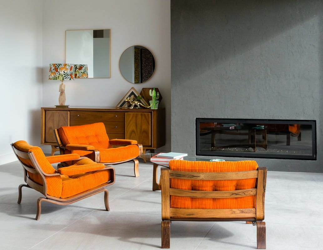 Bauhaus interior style with bold orange armchairs