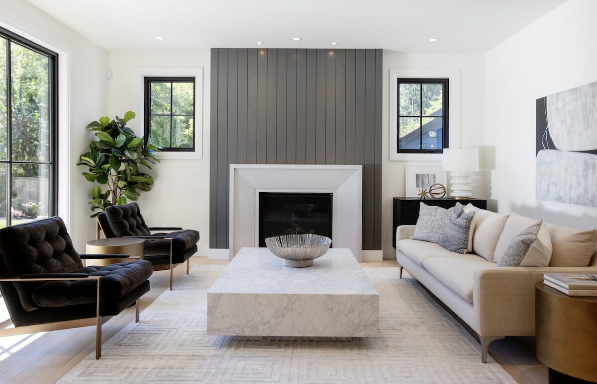 Contemporary living room arrangement with a fireplace by Decorilla designer, Dina H.